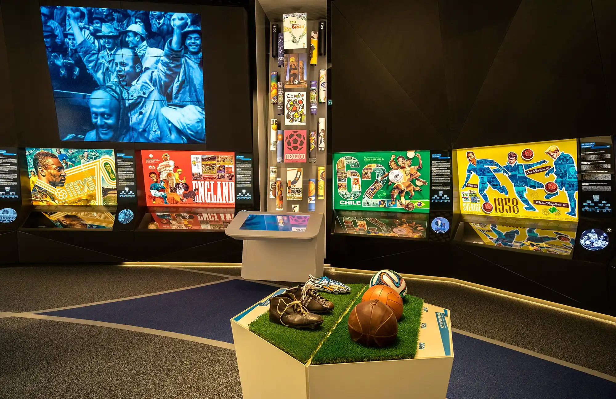 Historic football displays and World Cup memorabilia inside the FIFA World Football Museum in Zurich, featuring vintage footballs, boots and colourful tournament posters.